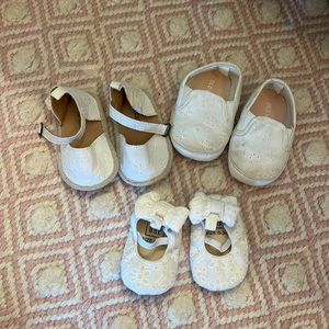 3 pairs of white baby girl shoes